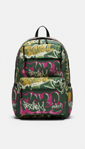 Graffiti-marked backpack in grip tape green